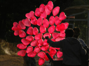 red heart shaped helium balloons